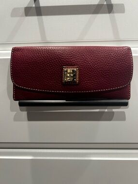 Dooney & Bourke Burgundy Pebbled Leather Continental Wallet with Gold Logo